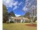 Charming single-story home featuring a well-manicured lawn and traditional architectural details at 248 Valley Way, Hampton, GA 30228