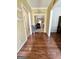 Hallway with hardwood floors, neutral paint, and views into the living room at 248 Valley Way, Hampton, GA 30228