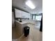Bright kitchen with white cabinets, tile flooring, and breakfast nook with bay windows at 248 Valley Way, Hampton, GA 30228