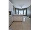 View of the kitchen area, with a sink overlooking a bright breakfast nook area at 248 Valley Way, Hampton, GA 30228