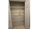 The linen closet features abundant wire shelving with double doors for ease of access at 248 Valley Way, Hampton, GA 30228
