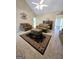 Large living room with vaulted ceiling, area rug, and plenty of seating at 248 Valley Way, Hampton, GA 30228