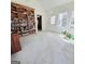 Bright living room featuring a large bookshelf and natural light from windows at 248 Valley Way, Hampton, GA 30228