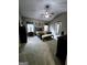 Carpeted main bedroom featuring a ceiling fan, ensuite access and neutral-toned walls at 248 Valley Way, Hampton, GA 30228