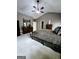 Spacious carpeted main bedroom with vaulted ceiling, ceiling fan, and ensuite access at 248 Valley Way, Hampton, GA 30228