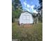 Backyard shed offering convenient storage with double doors and an attached lean-to for extra space at 248 Valley Way, Hampton, GA 30228