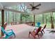 Relaxing covered deck is complete with outdoor seating and a ceiling fan at 1022 Miss Amber Way, Locust Grove, GA 30248