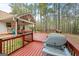 Inviting back deck is perfect for outdoor entertaining and relaxing in a wooded setting at 1022 Miss Amber Way, Locust Grove, GA 30248