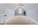 Upstairs bedroom featuring neutral paint and carpet, a ceiling fan, and natural light at 1022 Miss Amber Way, Locust Grove, GA 30248