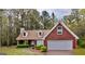 Charming brick home with attached two-car garage and well-maintained landscaping at 1022 Miss Amber Way, Locust Grove, GA 30248