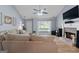 Comfortable living room showcasing a brick fireplace and ample seating at 1022 Miss Amber Way, Locust Grove, GA 30248