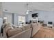 Bright living room with wood floors, a brick fireplace, and natural light at 1022 Miss Amber Way, Locust Grove, GA 30248