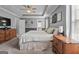 Cozy main bedroom with carpet, crown molding, and tray ceilings at 1022 Miss Amber Way, Locust Grove, GA 30248