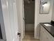 Bathroom features vanity, countertop and mirror and tub shower at 20 Fairway Ln, Peachtree City, GA 30269