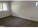 Bedroom with neutral carpet, walls, and natural light from windows at 20 Fairway Ln, Peachtree City, GA 30269