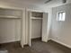 Spacious bedroom closet with double doors and custom shelving offers ample storage space at 20 Fairway Ln, Peachtree City, GA 30269
