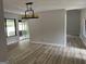 Bright room featuring new floors, slider to outside, and modern light fixture at 20 Fairway Ln, Peachtree City, GA 30269