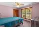 Bedroom with carpet, a ceiling fan, window and neutral walls at 426 Old Senoia Rd, Fayetteville, GA 30215