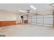 Clean and organized garage featuring a garage door and side entrance at 426 Old Senoia Rd, Fayetteville, GA 30215