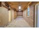 Spacious garage with brick walls, concrete floor, and built-in shelving for storing tools and equipment at 426 Old Senoia Rd, Fayetteville, GA 30215