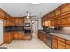 Retro kitchen design with wood cabinets, a ceiling fan, and a view to the backyard at 426 Old Senoia Rd, Fayetteville, GA 30215