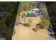 Aerial view of the property with estate house, detached garage, and spacious land and mature trees at 426 Old Senoia Rd, Fayetteville, GA 30215