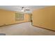 Neutral living room features carpet, a ceiling fan, window and neutral walls at 426 Old Senoia Rd, Fayetteville, GA 30215