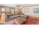 A large living room is furnished with comfortable seating and vibrant rugs over hardwood floors at 426 Old Senoia Rd, Fayetteville, GA 30215