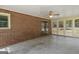 Spacious sunroom with brick accent wall and large windows overlooking the yard at 426 Old Senoia Rd, Fayetteville, GA 30215