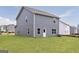 Home's backyard with freshly cut grass at 301 Limestone Circle, Conyers, GA 30013