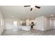 Open-concept living space with wood-look flooring and a modern kitchen at 301 Limestone Circle, Conyers, GA 30013
