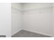 Walk-in closet with wire shelving and neutral carpet at 301 Limestone Circle, Conyers, GA 30013