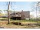 Expansive backyard featuring a large house, a creek, and a fenced perimeter offering privacy at 801 Streamside Dr, Mcdonough, GA 30252