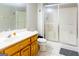 Bright bathroom with vanity, sliding glass door shower, and tiled floor at 801 Streamside Dr, Mcdonough, GA 30252
