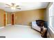 Spacious bedroom featuring neutral paint, ceiling fan, and natural light from a window at 801 Streamside Dr, Mcdonough, GA 30252