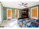 Bedroom with a ceiling fan, green walls, and a colorful bedspread at 801 Streamside Dr, Mcdonough, GA 30252