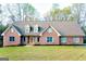Charming brick home with well-manicured lawn and inviting curb appeal at 801 Streamside Dr, Mcdonough, GA 30252