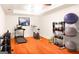 Home gym features hardwood floors, recessed lighting, treadmill and weight rack at 801 Streamside Dr, Mcdonough, GA 30252