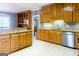 Traditional kitchen with wooden cabinetry, granite countertops, and stainless steel appliances at 801 Streamside Dr, Mcdonough, GA 30252