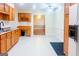 Spacious kitchen featuring tile flooring and hardwood cabinets at 801 Streamside Dr, Mcdonough, GA 30252