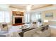 Cozy living room features a fireplace and comfortable seating area at 801 Streamside Dr, Mcdonough, GA 30252