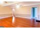 Expansive living room featuring rich hardwood floors and neutral wall colors for a serene atmosphere at 801 Streamside Dr, Mcdonough, GA 30252