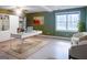 Home office with desk, chairs, and built in bookcases with natural light from a window at 801 Streamside Dr, Mcdonough, GA 30252