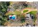 Aerial view of a backyard featuring a pool, a pergola, an outbuilding and the house at 85 Bryan St, Mcdonough, GA 30253