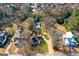 Stunning aerial view of home featuring a lush yard, inviting pool, and a charming neighborhood setting at 85 Bryan St, Mcdonough, GA 30253