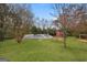 Expansive backyard featuring a pool, an outbuilding and a pergola, perfect for entertaining at 85 Bryan St, Mcdonough, GA 30253