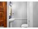 Bathroom featuring a vanity sink with modern fixtures, framed mirror, and bead board accent wall at 85 Bryan St, Mcdonough, GA 30253
