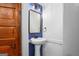 Bathroom featuring a vanity sink with modern fixtures, framed mirror, and bead board accent wall at 85 Bryan St, Mcdonough, GA 30253