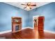 Cozy bedroom features a fireplace and ceiling fan, perfect for relaxation at 85 Bryan St, Mcdonough, GA 30253