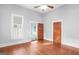 Bedroom featuring original hardwood floors and an en suite bathroom at 85 Bryan St, Mcdonough, GA 30253